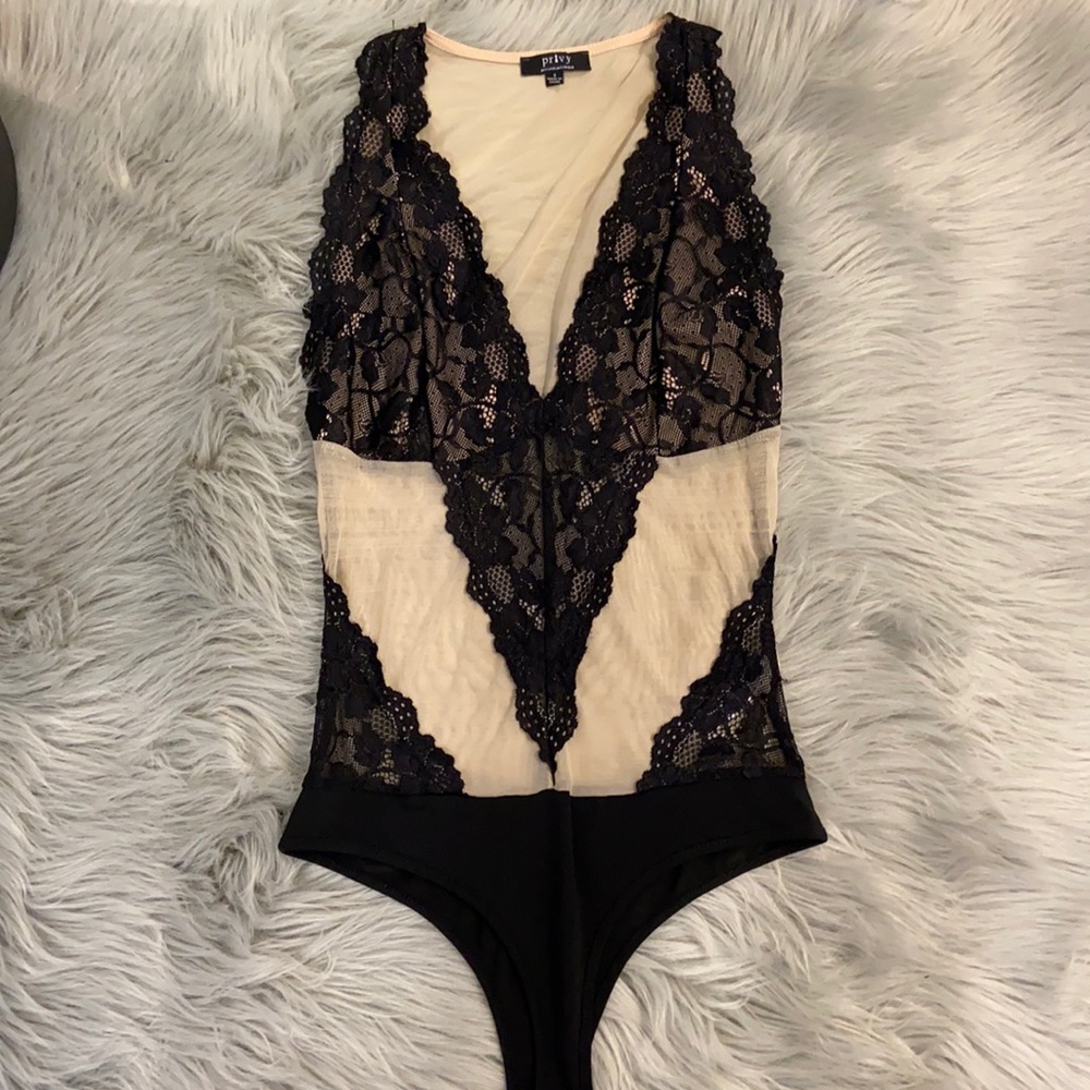 Nude and black lacy bodysuit